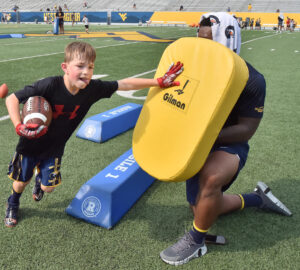 WVU players help with 3rd annual Country Roads Trust Camp